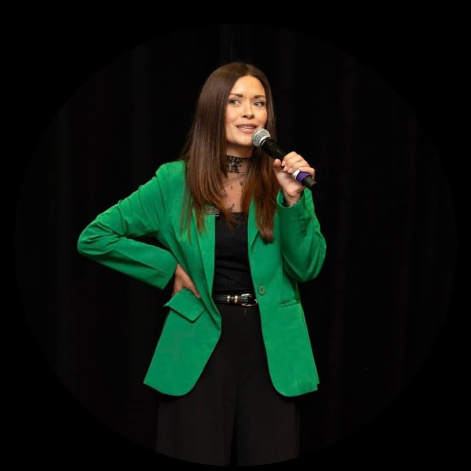 Ashley Caronna speaking on stage